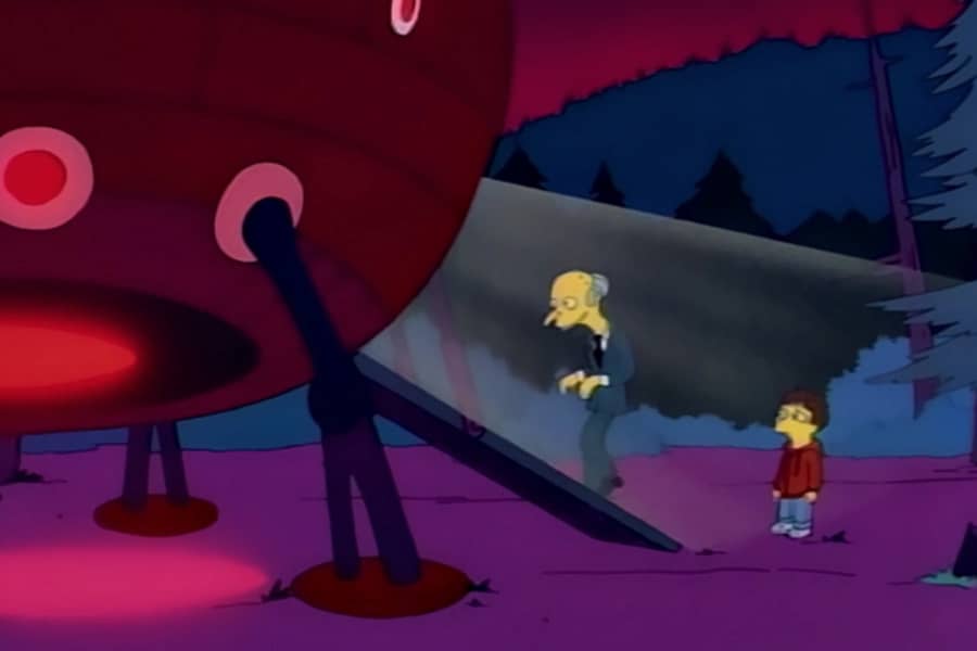 Mr. Burns walks up a ramp on to a spaceship as a boy watches