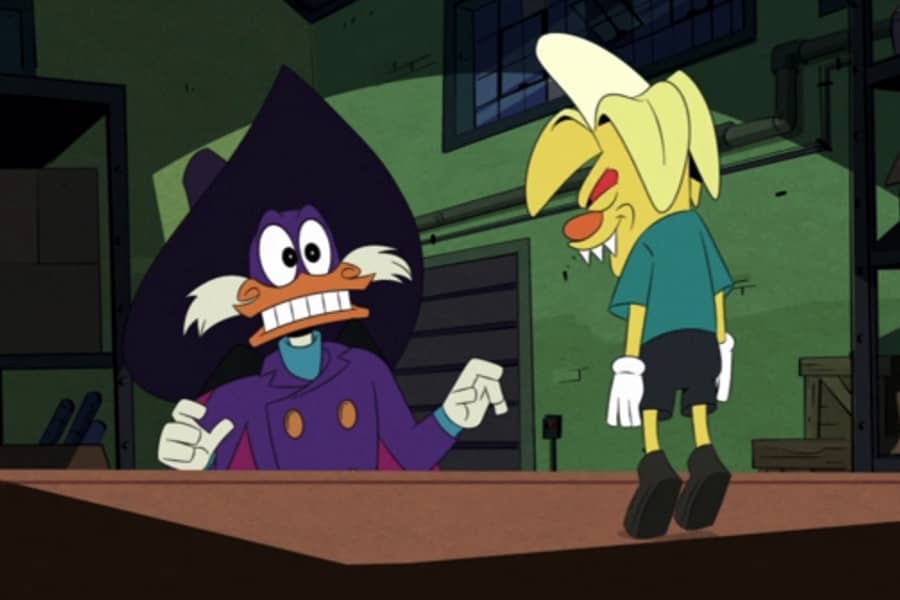 Darkwing Duck grimaces as a banana doll levitates with glowing red eyes