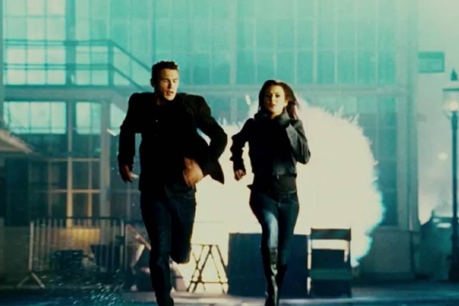 Lohan and Franco running away from an explosion