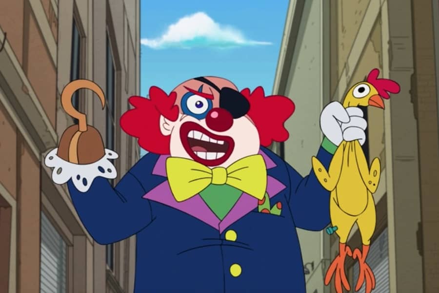 a clown with a hook for a hand holds a rubber chicken