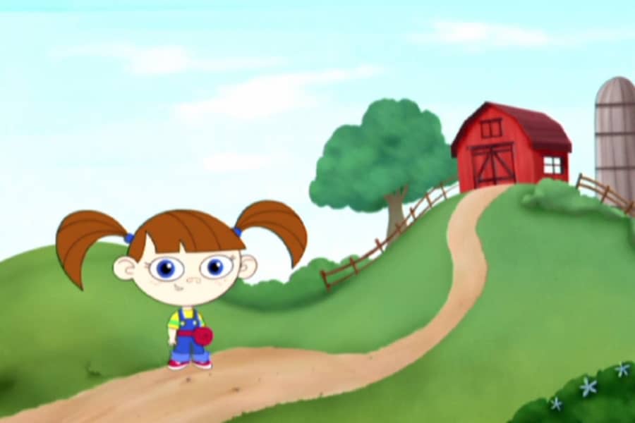 Lauren in front of a red barn