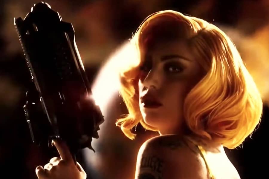Lady Gaga as La Camaleón also holding a huge gun