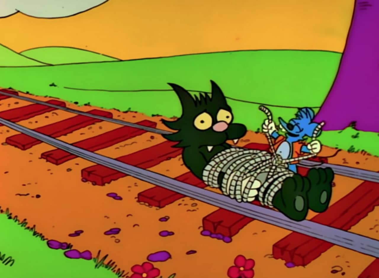 Itchy ties Scratchy to some railroad tracks