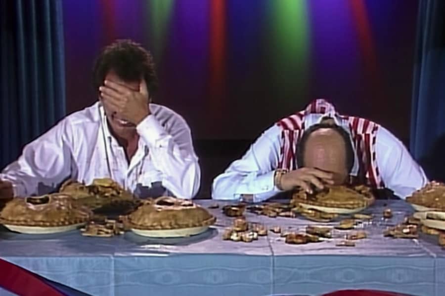 Sanders and Kingsley cracking up during a pie eating contest