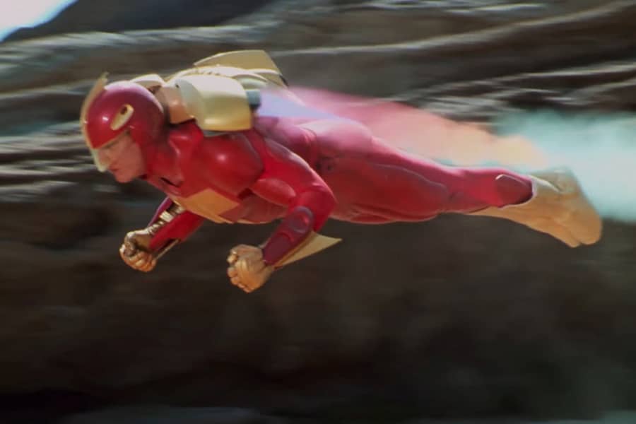 Turbo Man flying horizontally with a jetpack