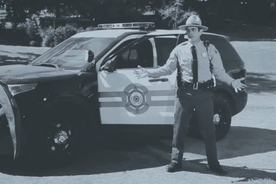 cop by his car