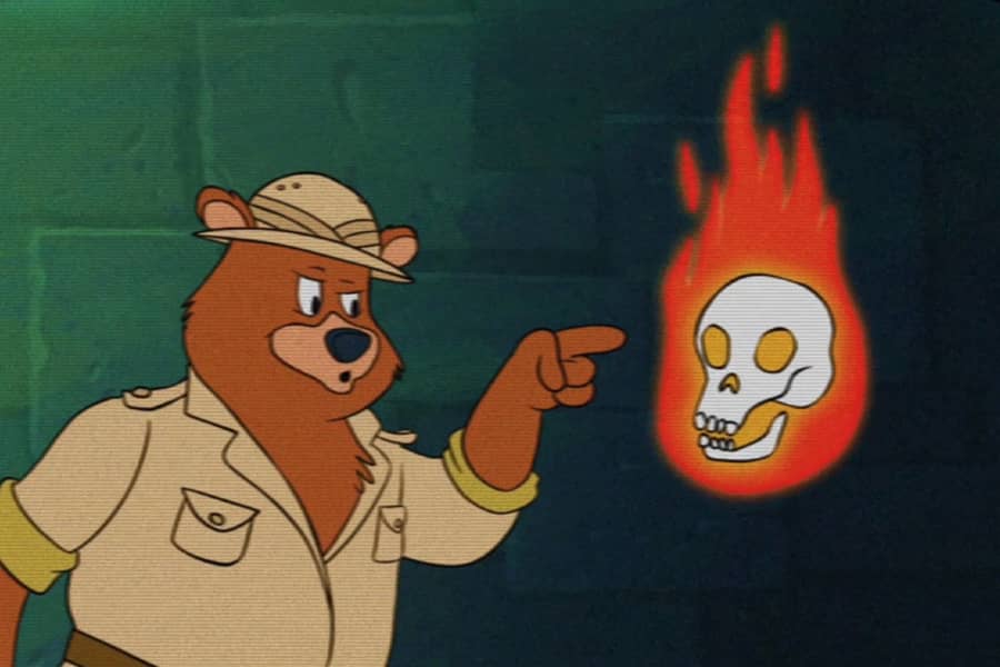 90’s Adventure Bear pointing at a floating, flaming skull