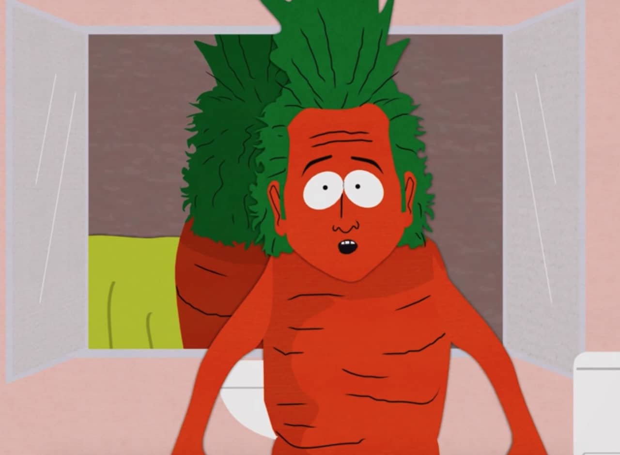 a shocked Rob Schneider has turned into a giant carrot