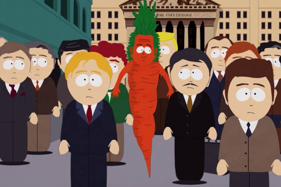 carrot Rob walking amongst a crowd of businessmen