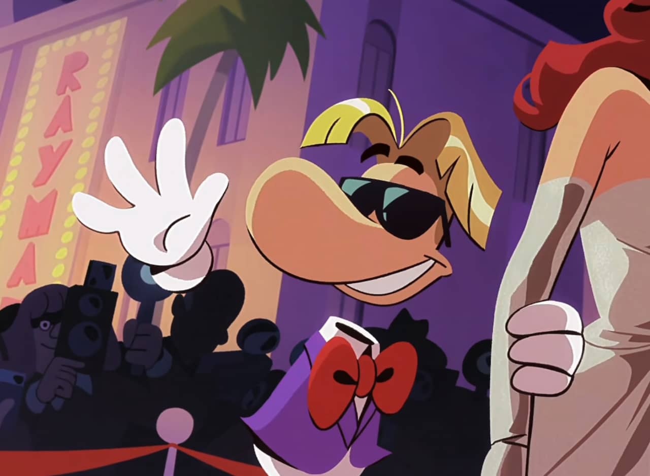 Rayman waving to a crowd at a Hollywood event