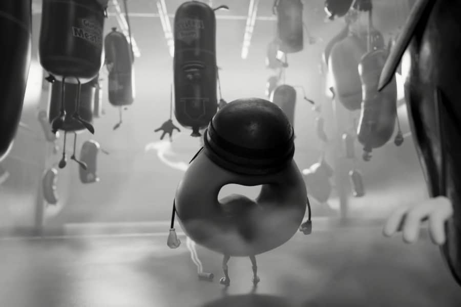 bagel looks upon a freezer with sausages hanging from the ceiling