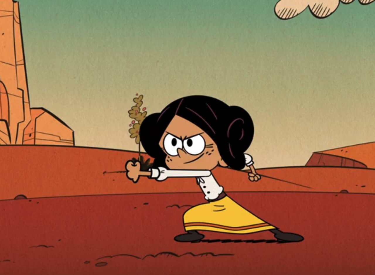 Anna, a young Hispanic girl, punching in the desert