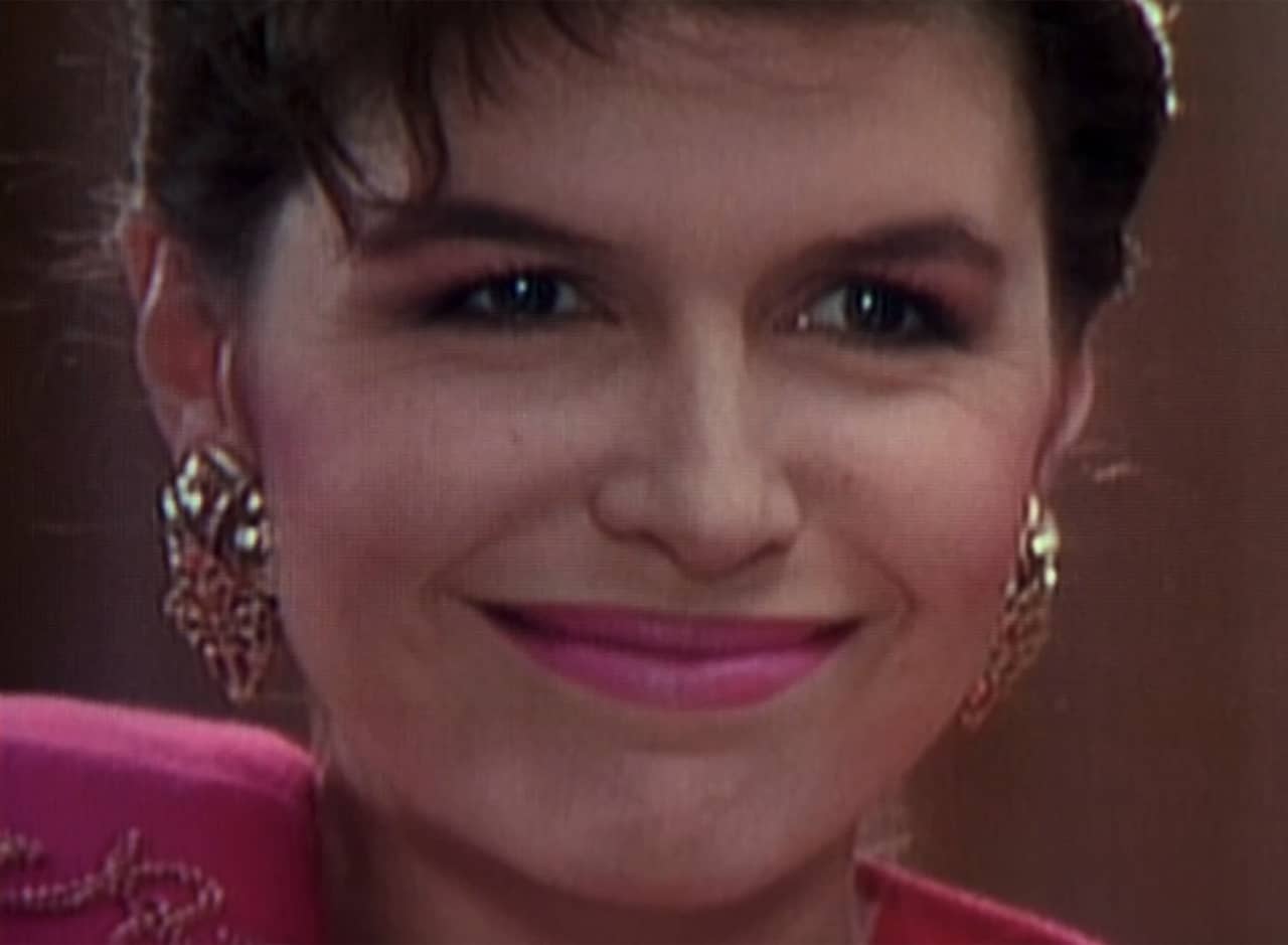 woman protagonist smiling