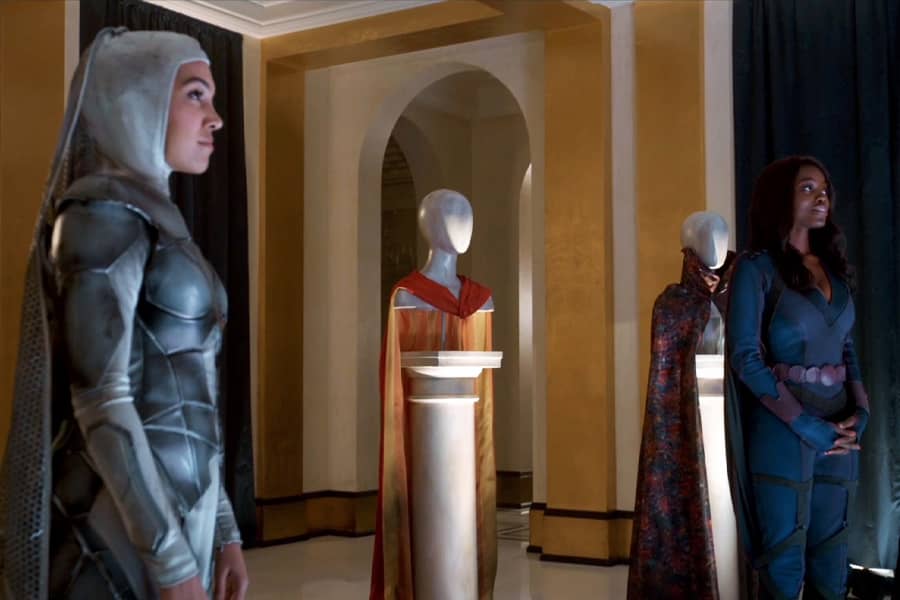 two contestants, a hijab-wearing female superhero, and a Black female superhero