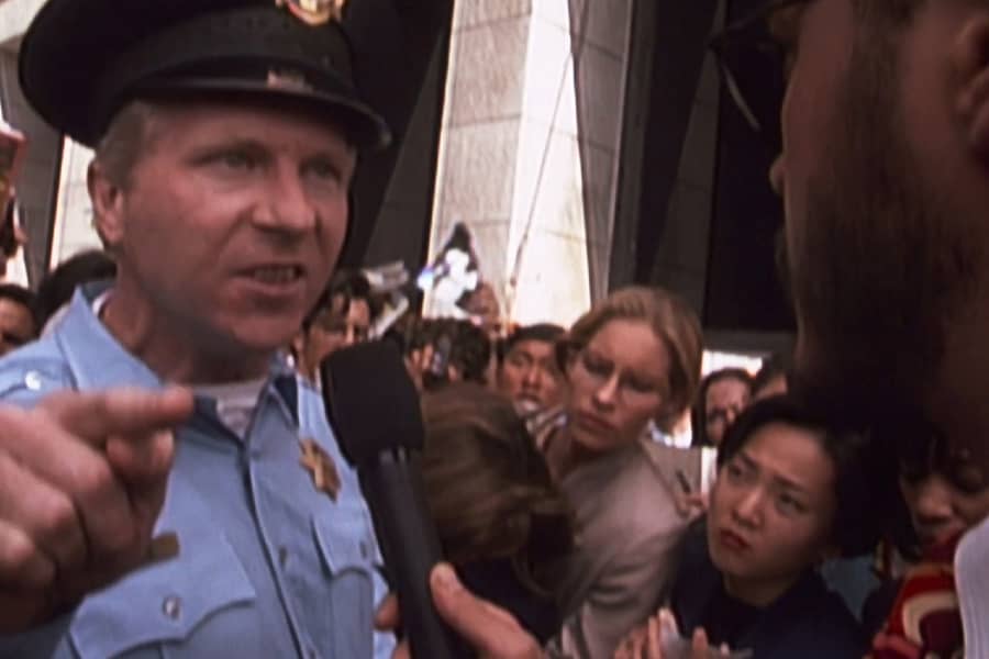 Gale interviewing an angry cop