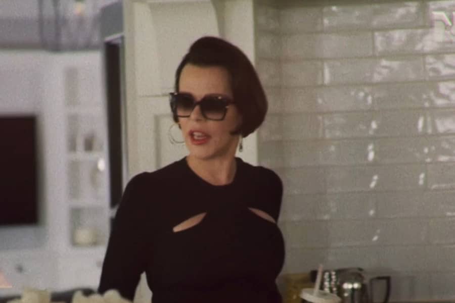 the mother with chic bob haircut and big sunglasses