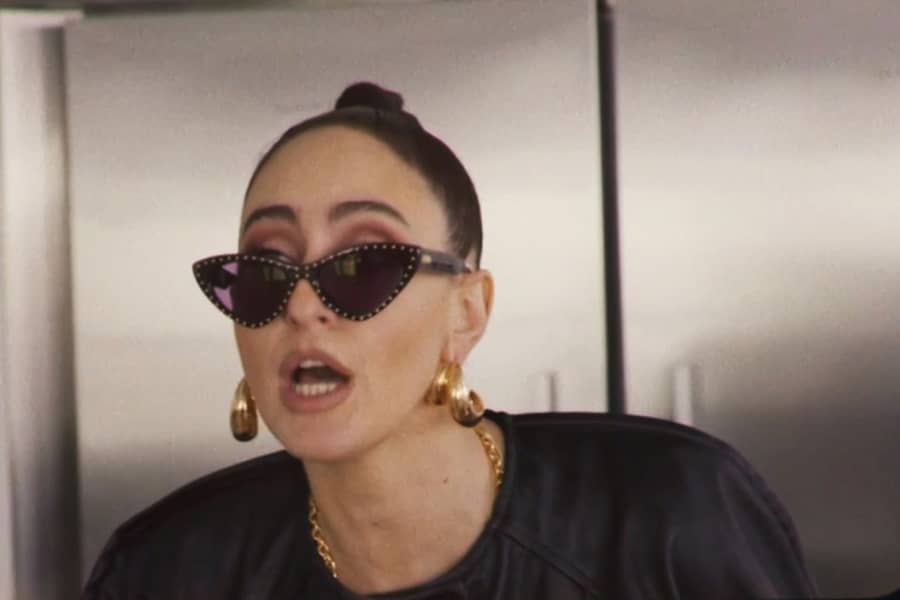 closeup of second daughter wearing dazzly sunglasses and big earrings