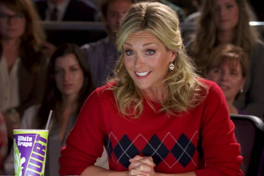 Jenna Maroney giving feedback with a smile