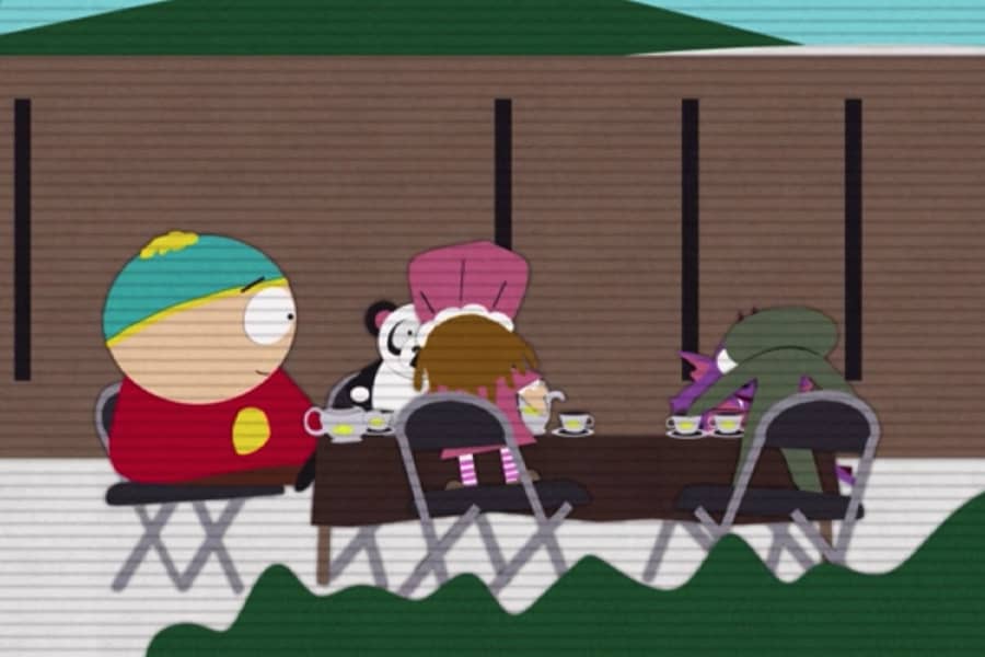 home video of a young boy having a tea party with stuffed animals