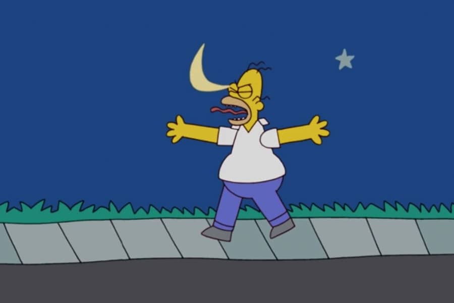 Homer walks down the sidewalk at night and is stuck in the eye by the crescent moon