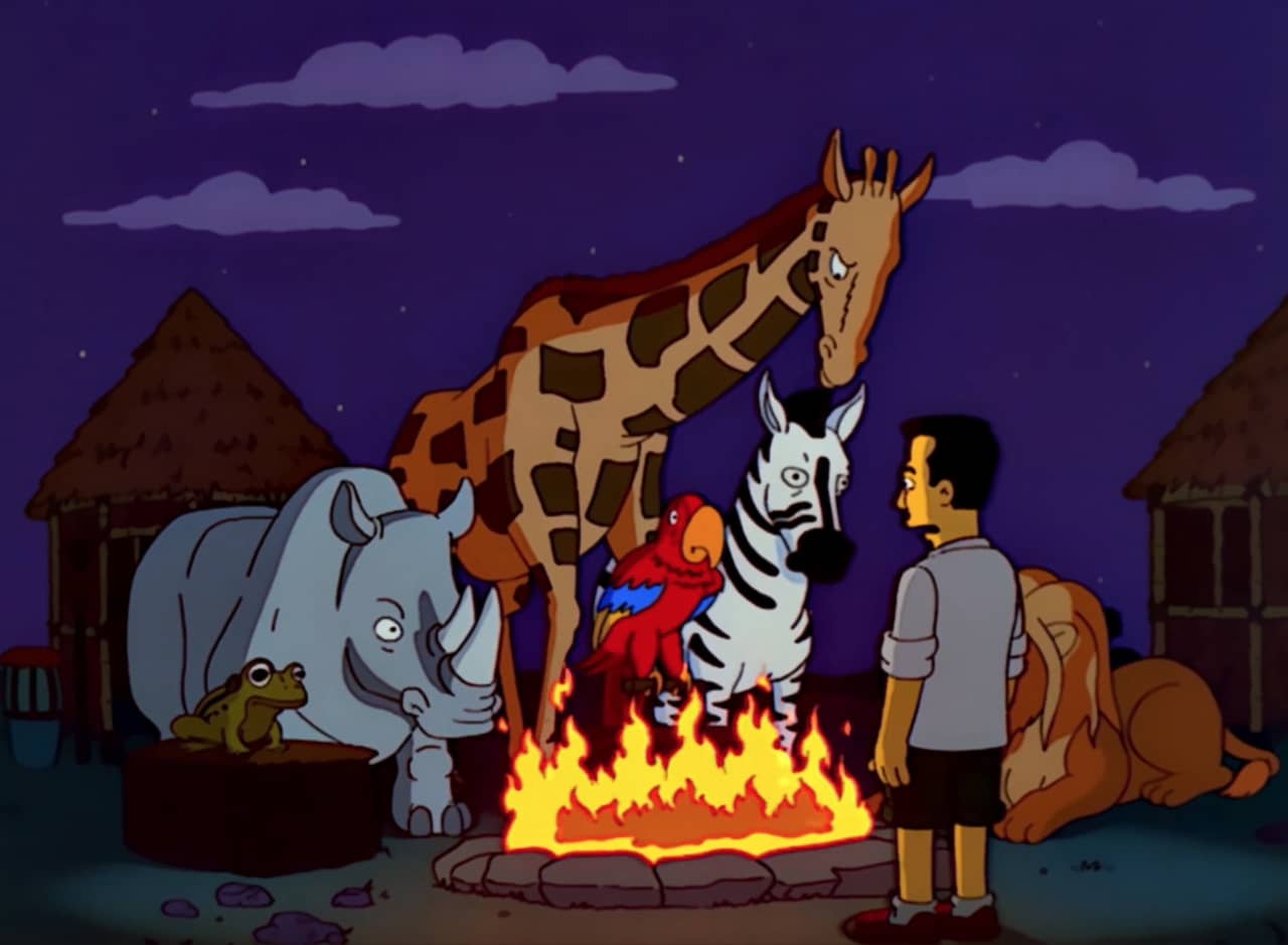 Jeff Probst at a campfire with a frog, rhino, giraffe, parrot, zebra and lion