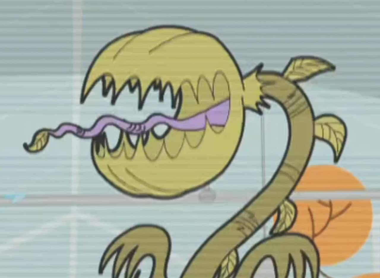 a giant plant with an open mouth and sharp teeth