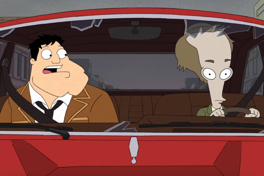 the Stans driving in a car with a blown out windshield