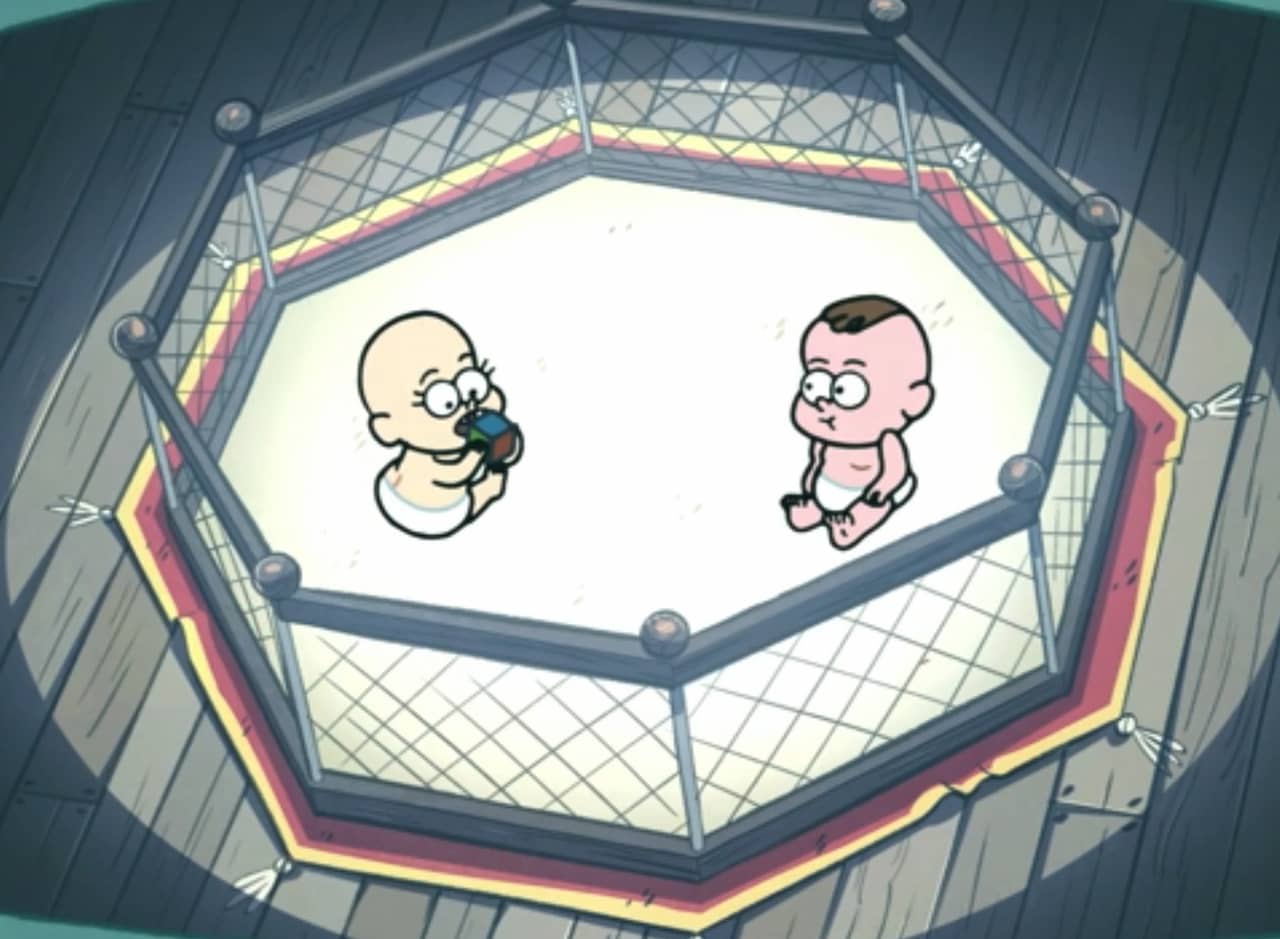 two babies sit in a fenced ring with a big spotlight on them