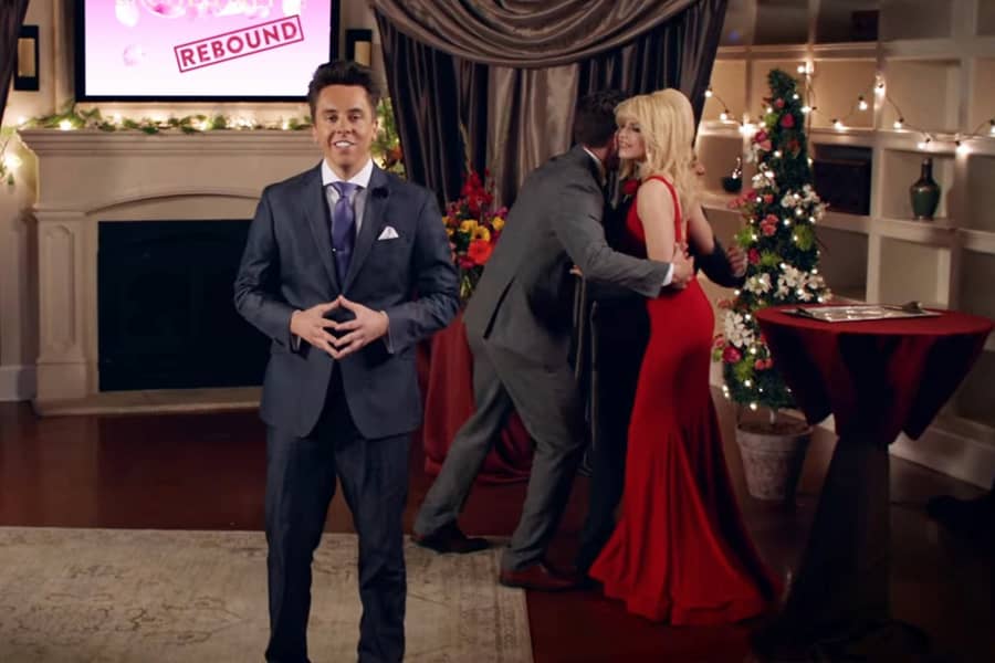Amy hugging two of the men with the host in the foreground