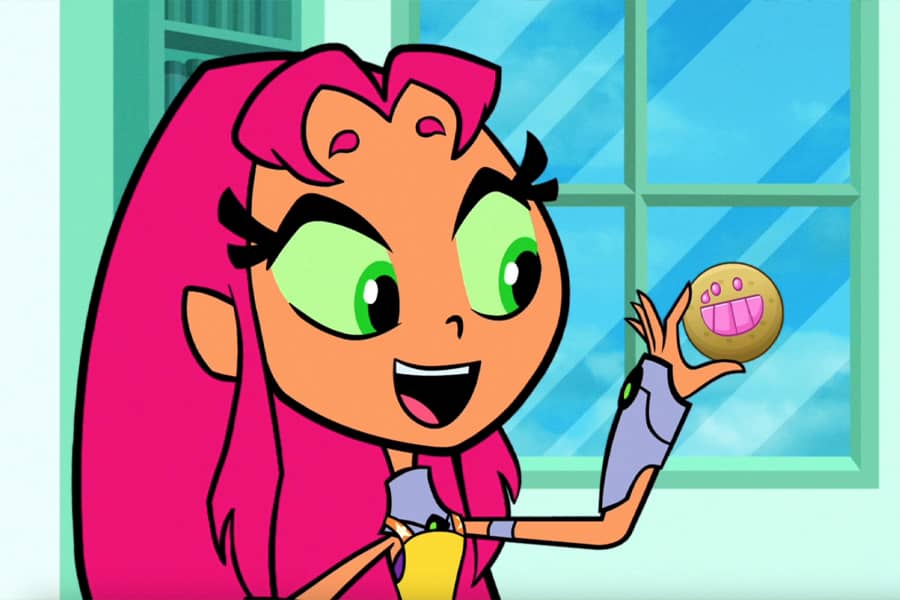 Starfire holding an emoji cookie