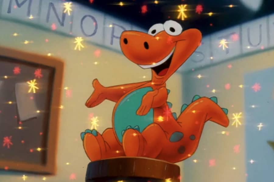 a stuffed toy dinosaur with magic sparkles all around it