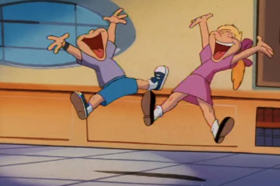 two kids jumping for joy