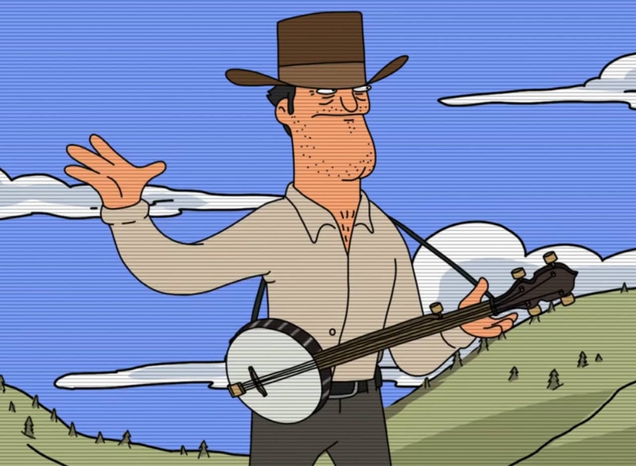 a tough-looking cowboy strums a banjo