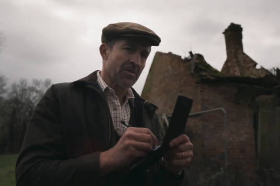 Detective writing in a notepad