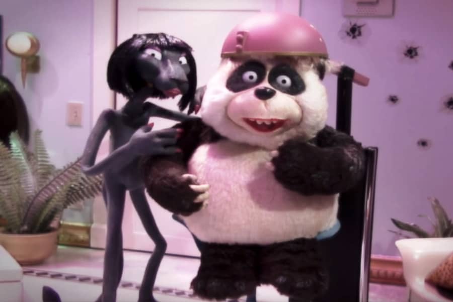 Minou with Chi Chi the panda under a hair dryer