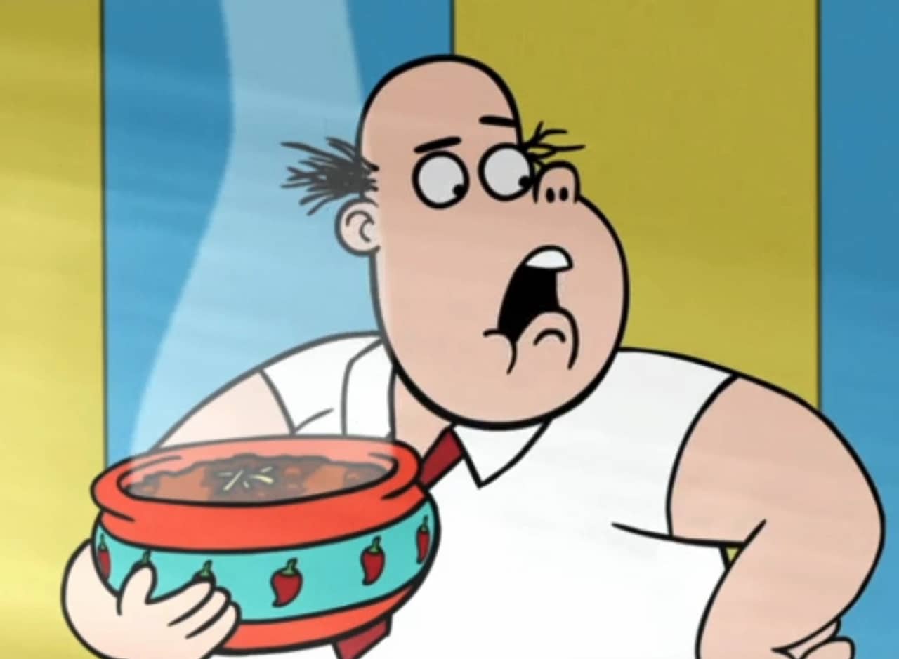 bald oaf holding a steaming bowl of chili