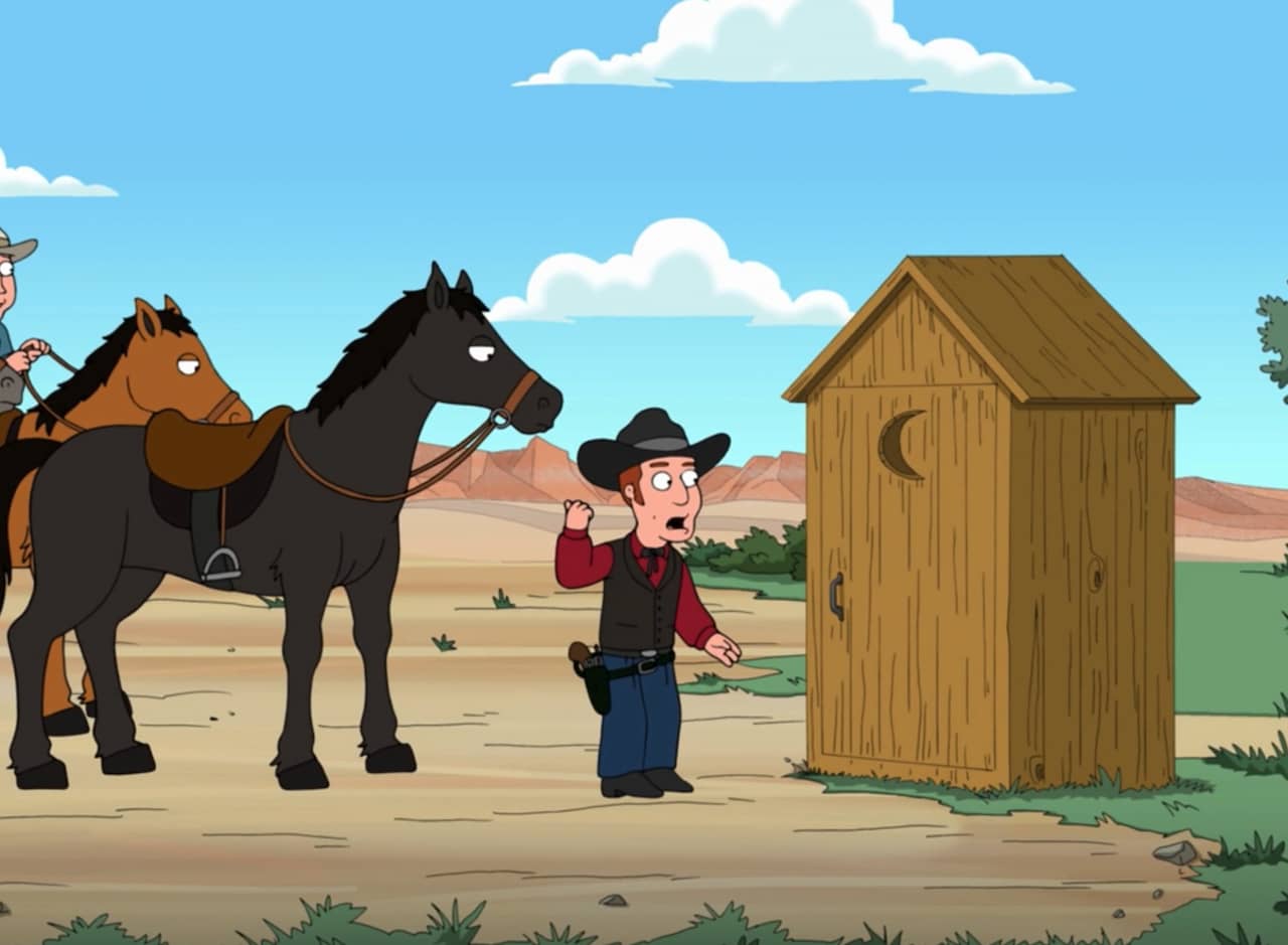 a cowboy reluctantly talks to a closed outhouse