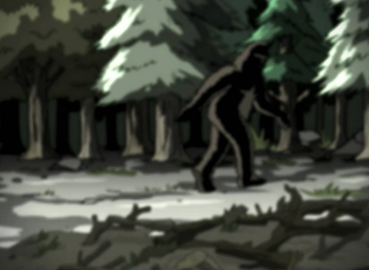 blurry photo of Bigfoot walking in the forest