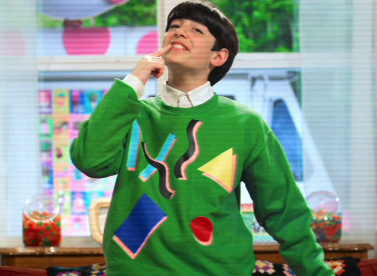 Marcus Kane as Lenny Scoops, a teen boy in a colorful sweater