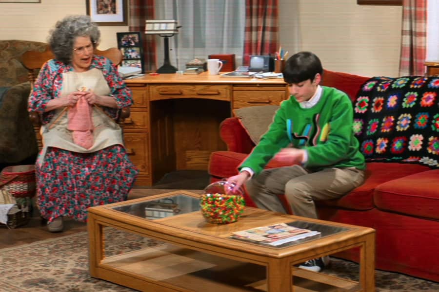 Lenny’s grandmother knitting on a rocking chair and yelling at Lenny about the candy