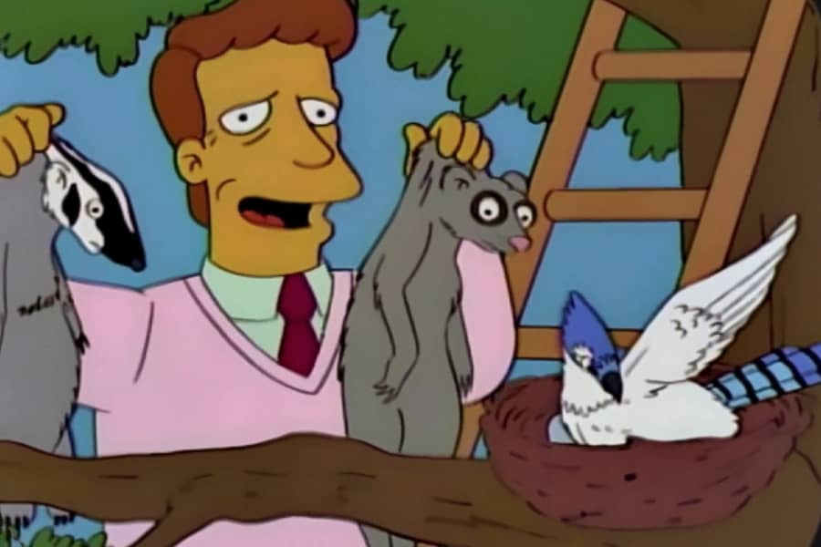 Troy holding up two badgers by the bird