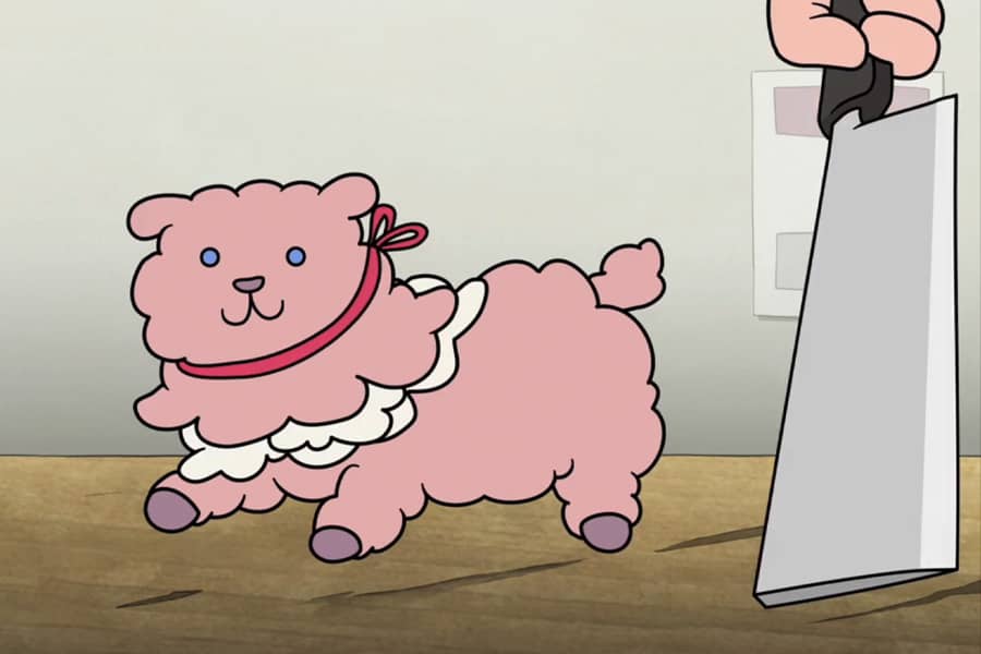 a butcher knife slicing through a stuffed lamb