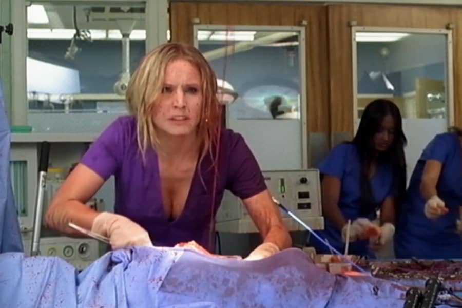 Claire operating while covered in blood