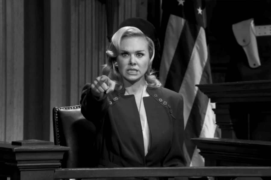 Bridget Bailey points from the witness stand