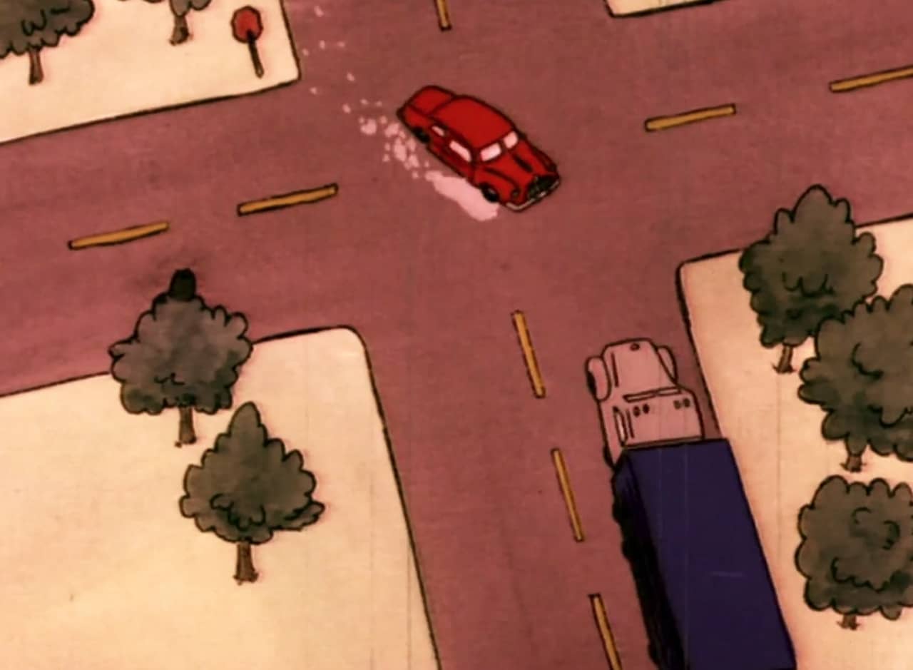 aerial view of an intersection where a red car is swerving into the path of a semi-truck