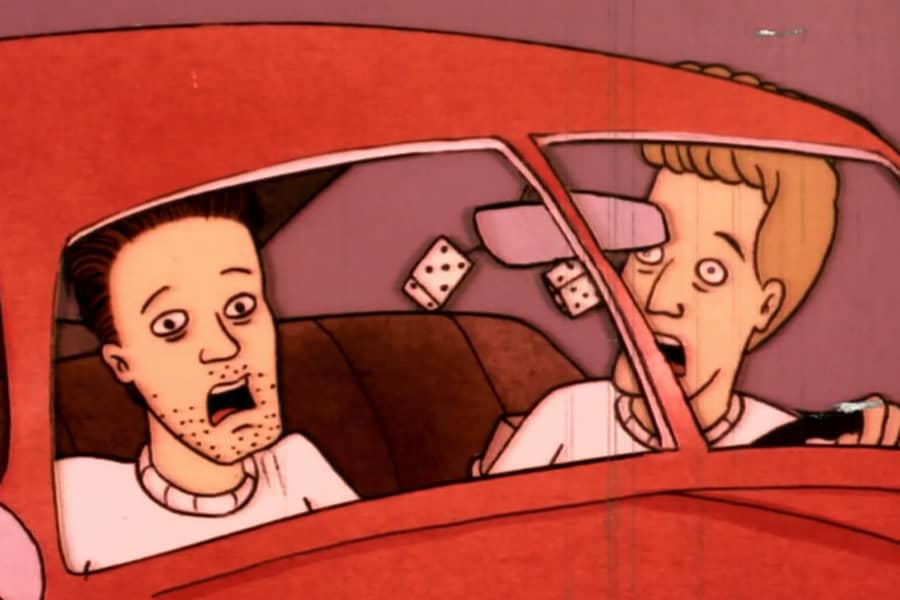 two dudes screaming in a car