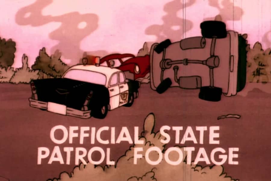 a smoldering three-car accident with text “Official state patrol footage”