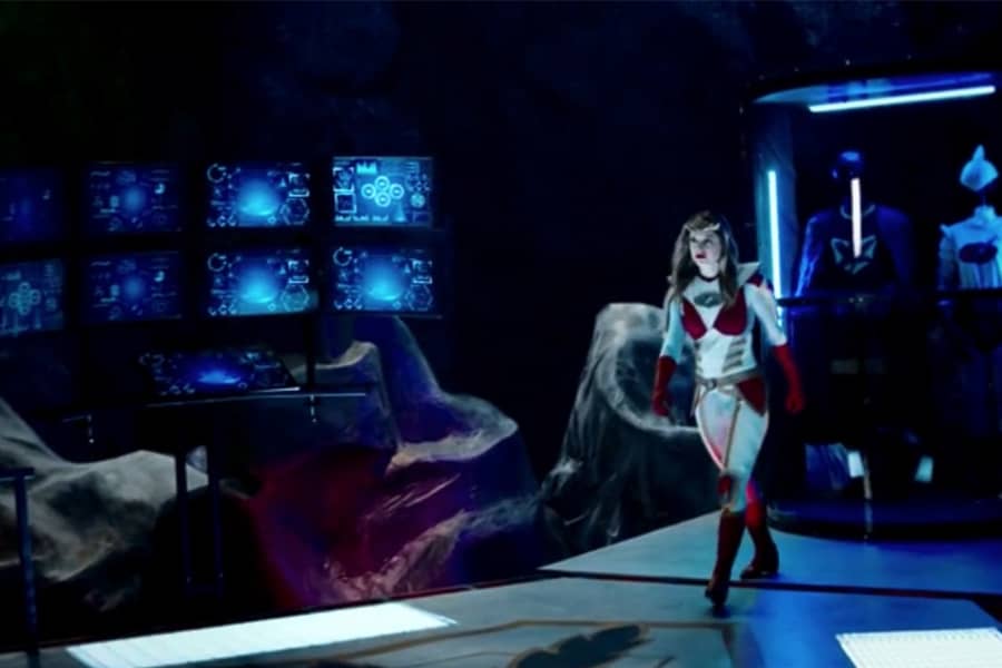 Melissa Benoist as Chronic walking through a superhero lair