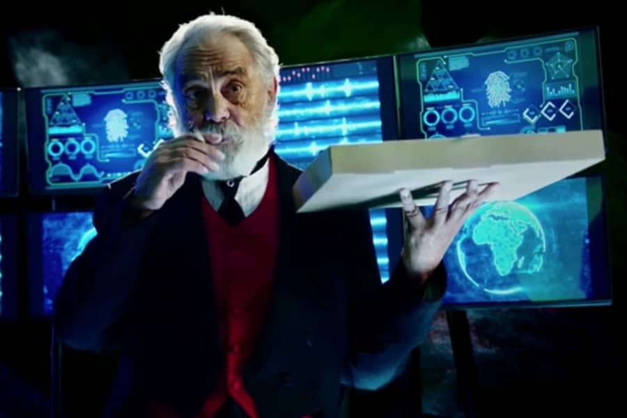 Tommy Chong as Alfred smoking a joing and holding a pizza box