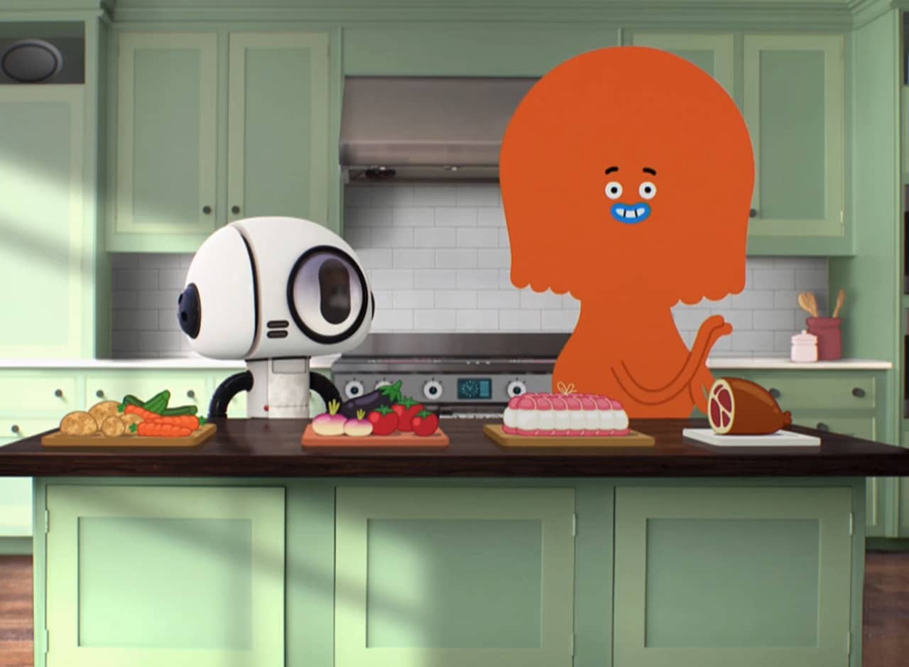 Bobert and Felicity in a home kitchen with foods on the counter